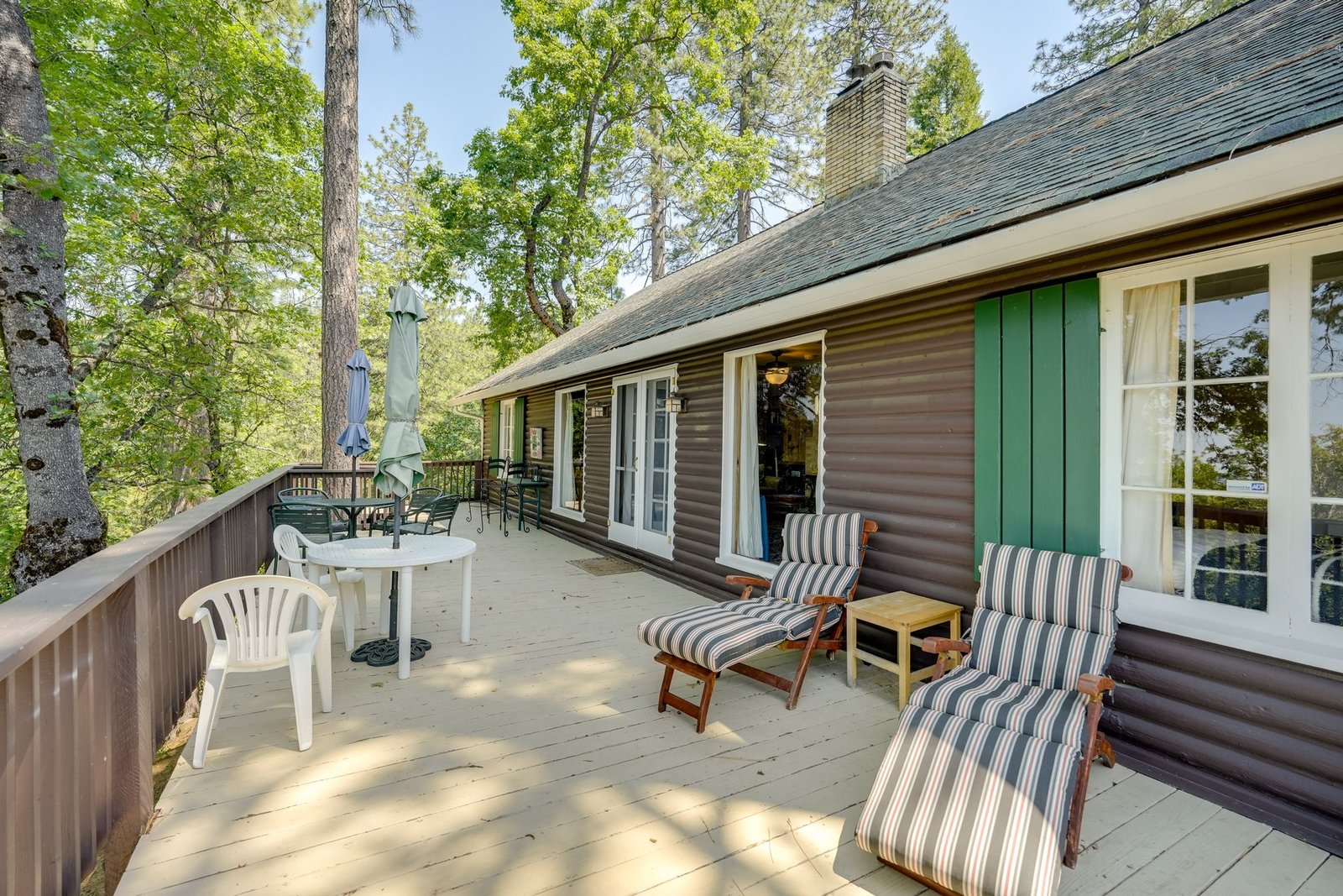 Wraparound deck with forest views